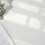 Personal loan calculator USA showing monthly payment calculation on a desk